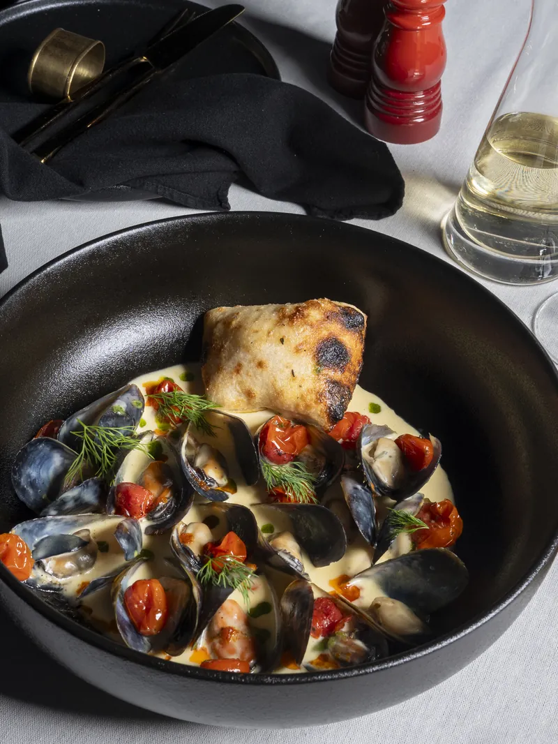 Mussels in a creamy sauce with folded flatbread